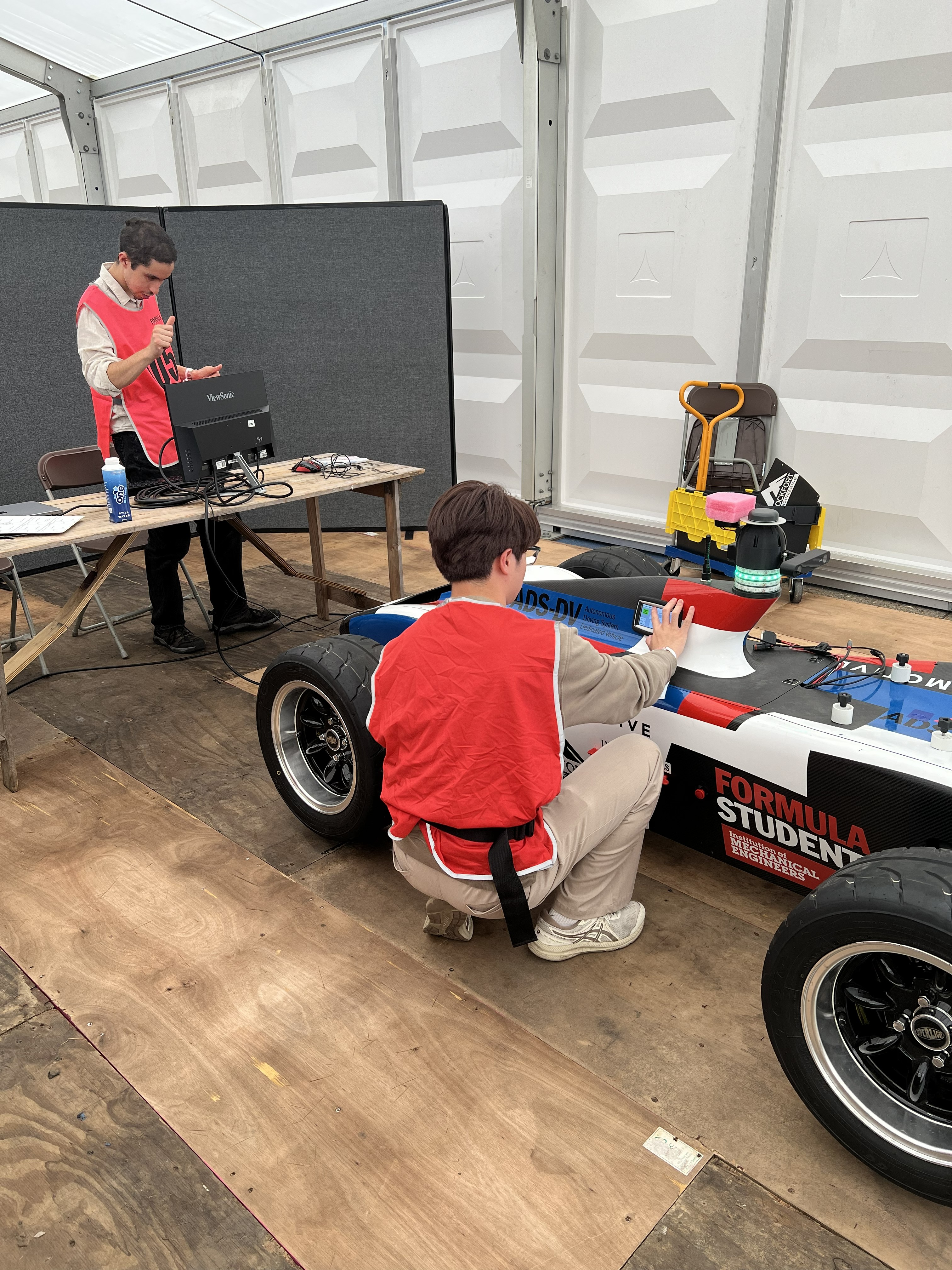Yasser and Dylan carrying out scrutineering